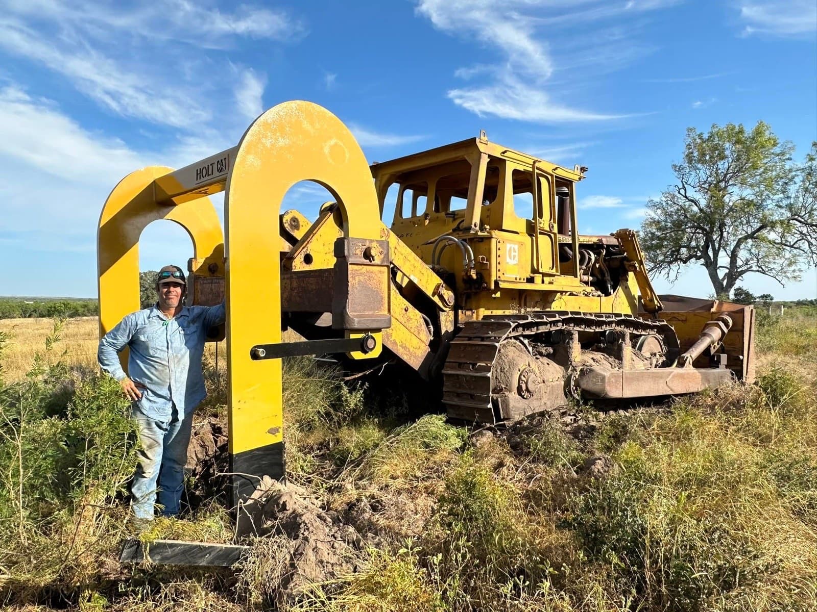 Joe Neal with the 1977 Cat D9H and Holt Cat root plow stinger